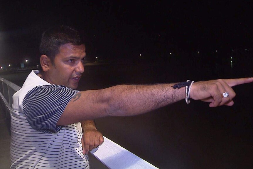 Chirag Modi points at the spot he saw a swimmer in trouble.