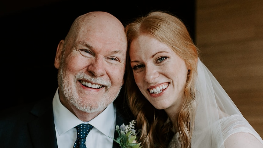 A man pictured with his daughter on her wedding day.