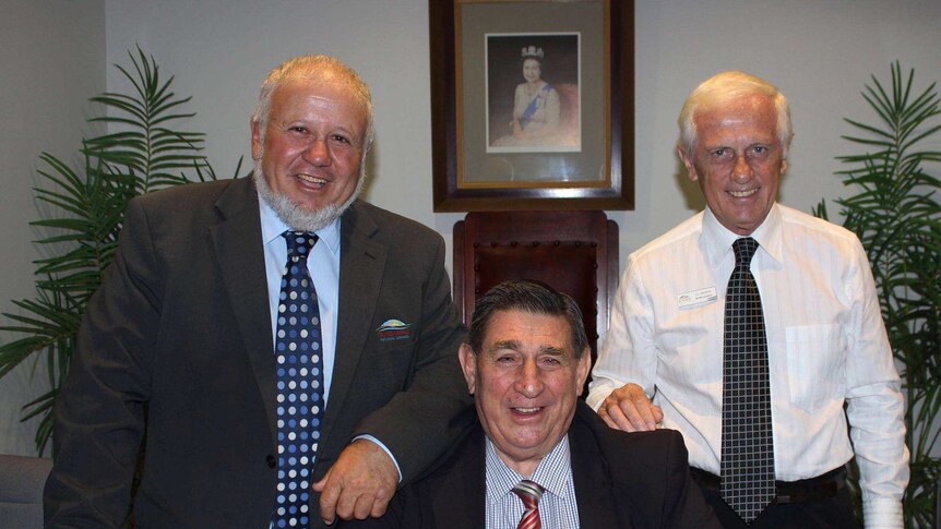 Councillors Tony Riccardi and Danny Rowleson, stand behind Mayor Mal Forman.