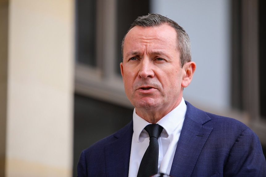 WA premier Mark McGowan wearing a suit and tie outside parliament