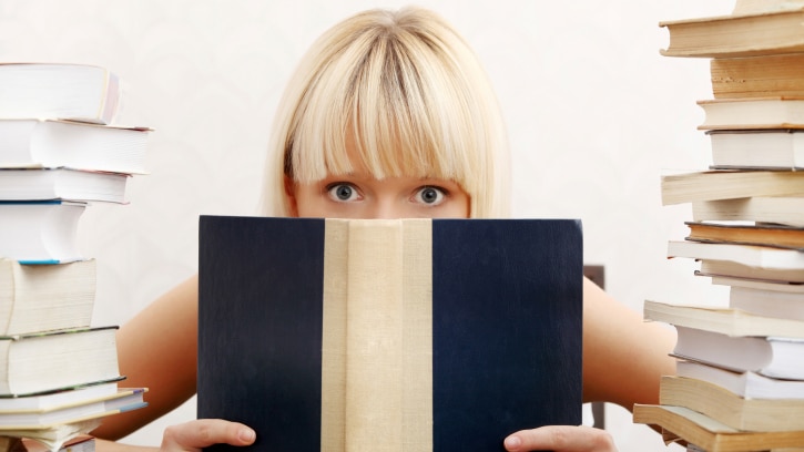 Woman with books, file photo (Thinkstock)