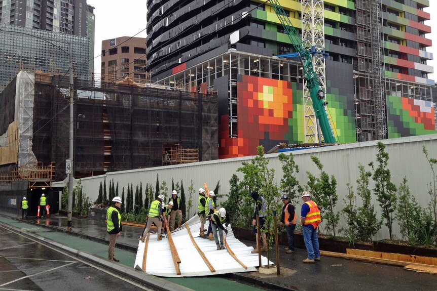 Strong winds send roof onto footpath at site of 2013 wall collapse