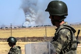 Turkish soldiers stand guard on Syrian border