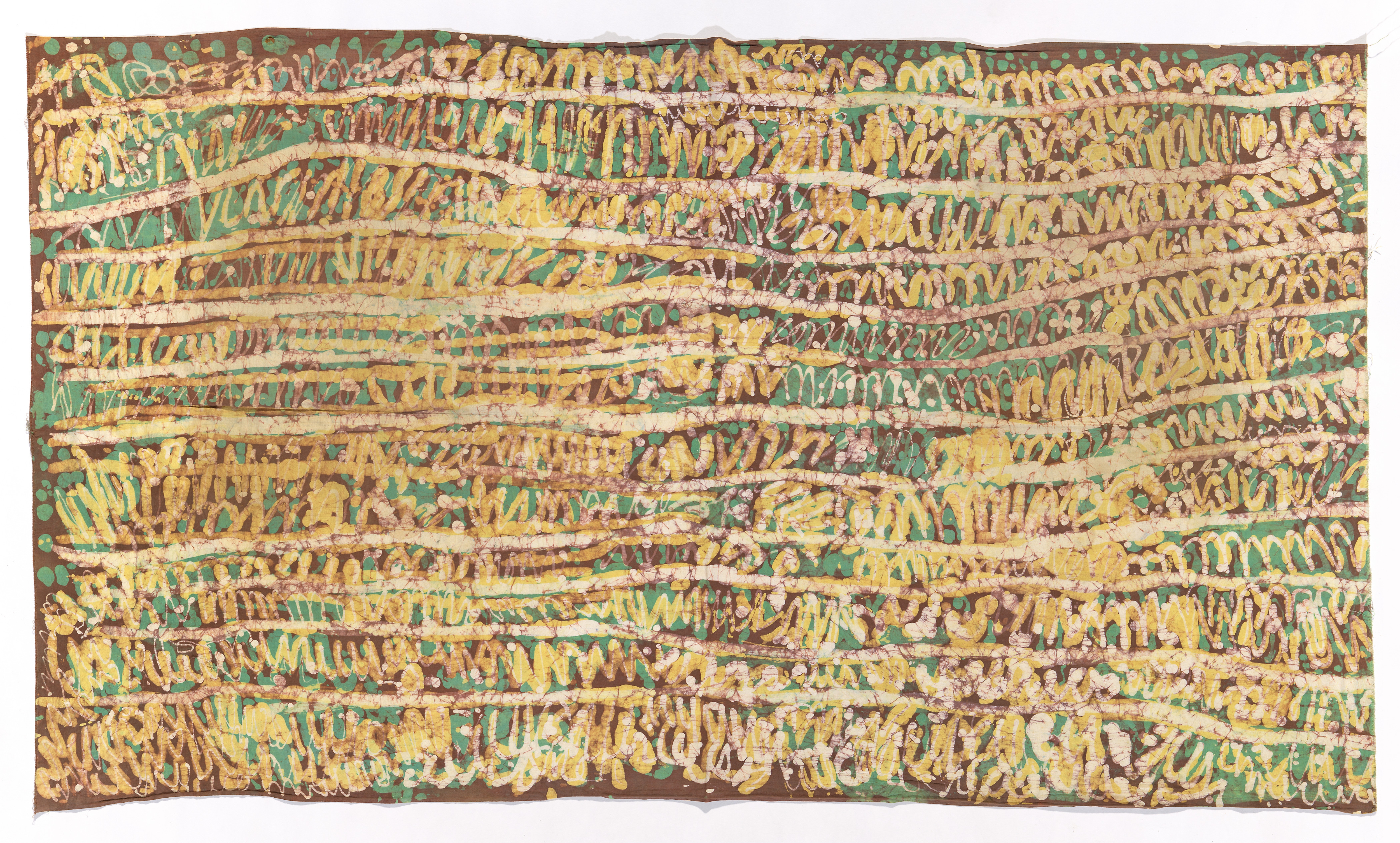 A batik artwork with squiggled rows of green and yellow lines on a brown background