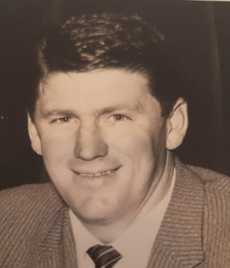 A black and white photo of a man.