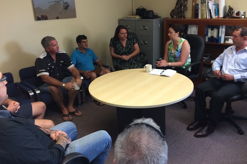 Annastacia Palaszczuk sits around a round table with Queensland Nickel workers.