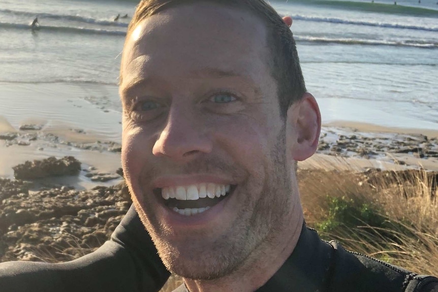 Melbourne surfer Mark Quinn throws the 'hang loose' shaka sign.