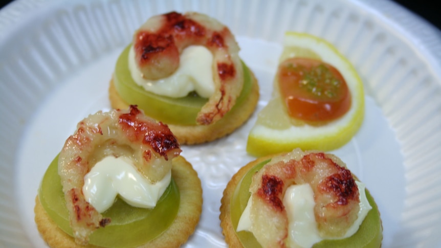 Photo of three prawns on a plate