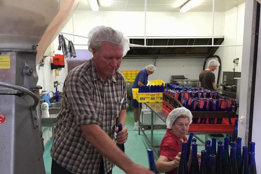 Stuart Meagher from Disaster Bay Chillies on the production line at his processing facility in Eden