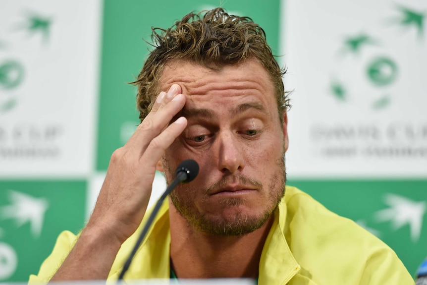 Lleyton Hewitt rubs his wrinkled forehead during a press conference in his capacity as Davis Cup captain.
