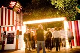 Festival-goers line up before a performance