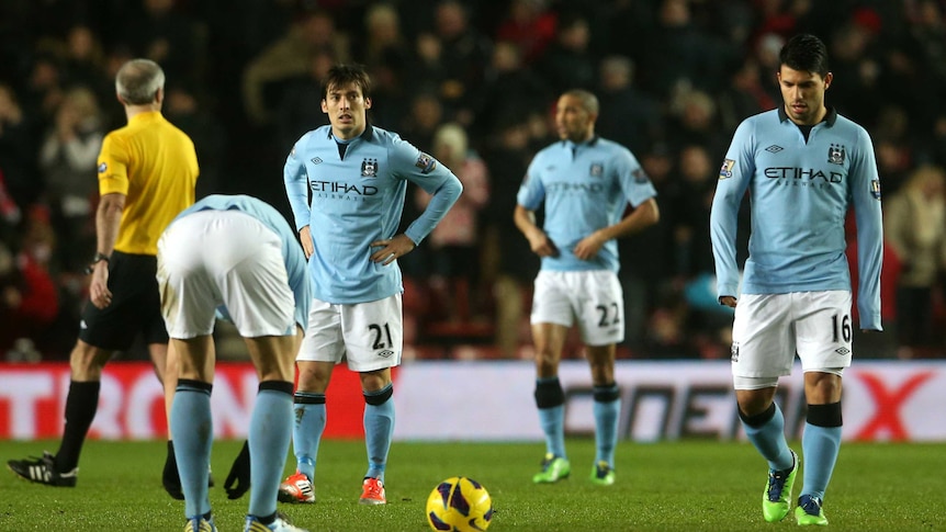 City shocked ... David Silva and Sergio Aguero trudge off off after City's 3-1 loss to Southampton.