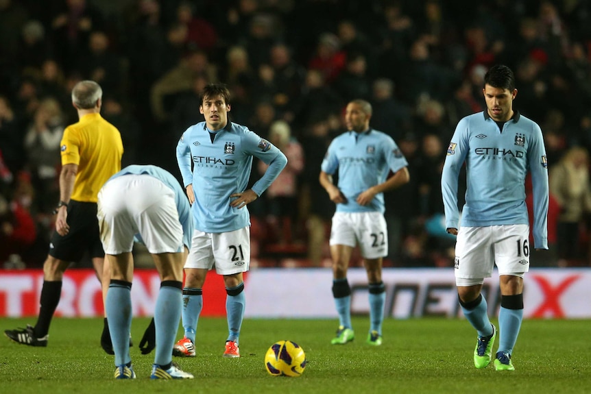 City shocked ... David Silva and Sergio Aguero trudge off off after City's 3-1 loss to Southampton.
