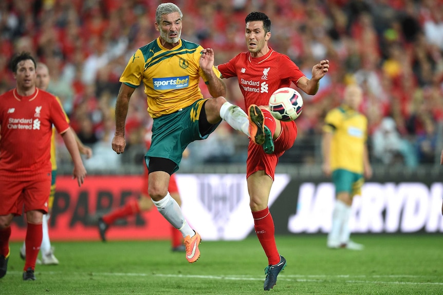 Craig Foster competes for possession with Luis Garcia the Liverpool Legends v Australian Legends in Sydney in 2016