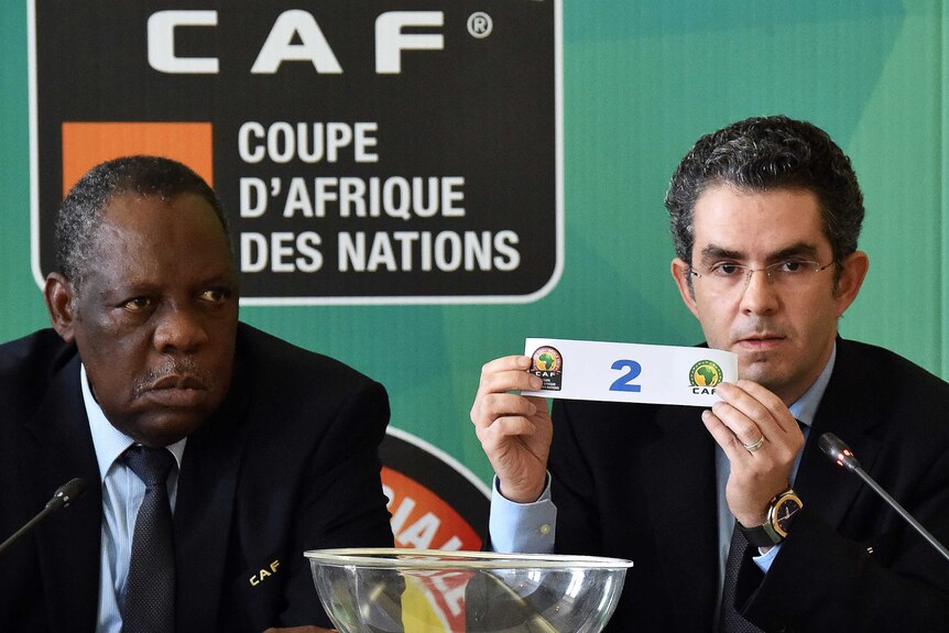 CAF president Issa Hayatou (L) at an African Cup of Nations quarter-finals draw in January 2015.