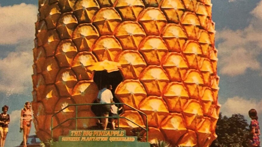 An old colour photo showing tourists going inside the Big Pineapple at Nambour on Queensland's Sunshine Coast.