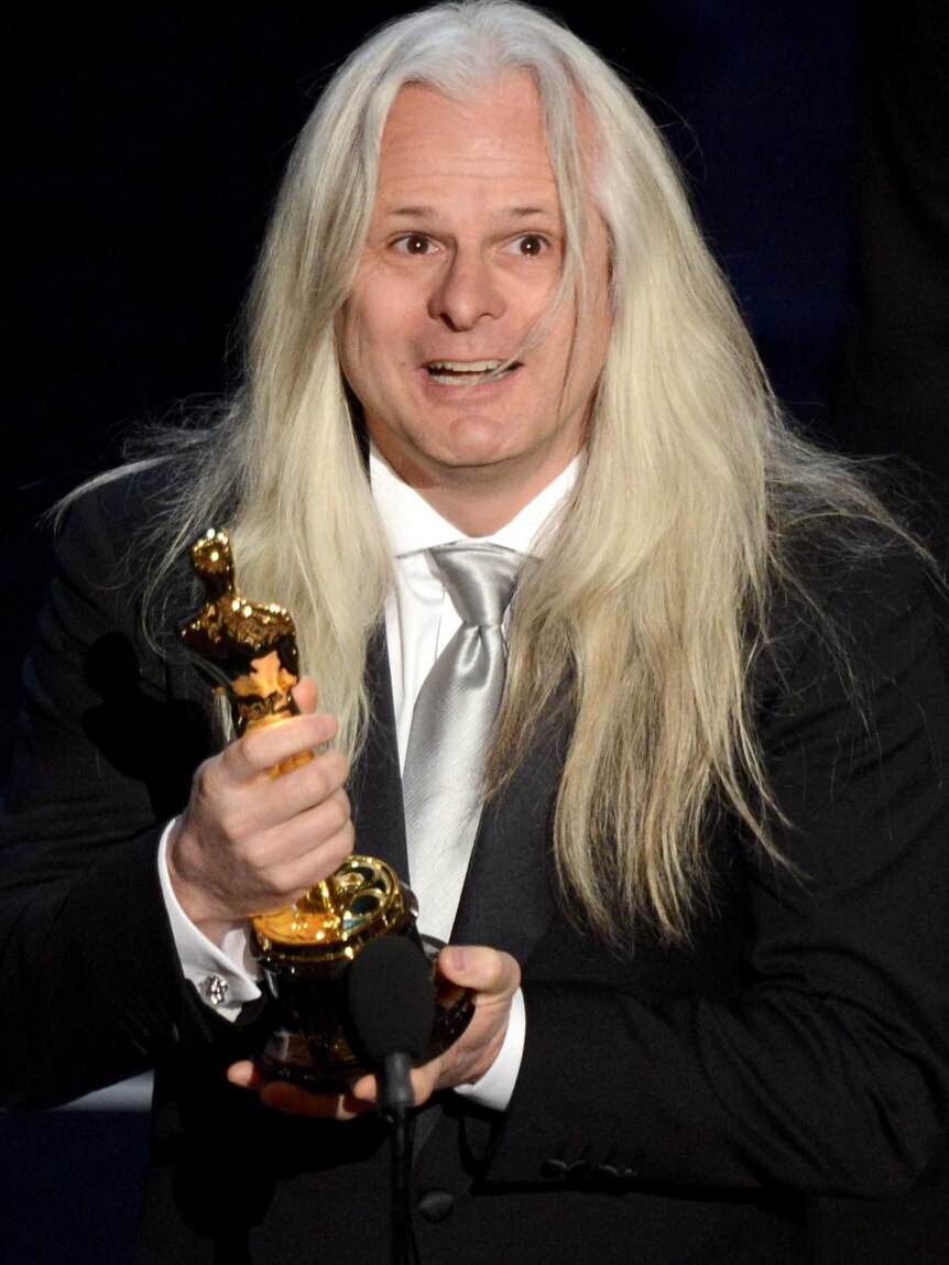 Claudio Miranda accepts his Best Cinematography Oscar.