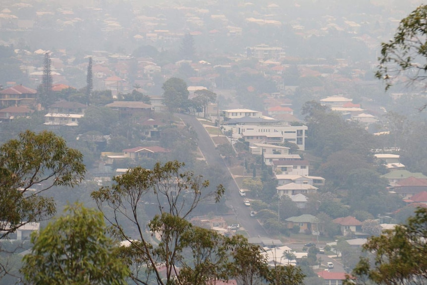 Smoke haze over homes below Mount Gravatt lookout.
