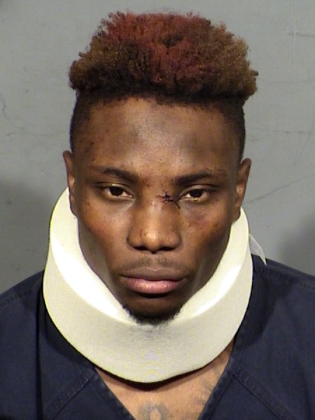 A police handout photo of Henry Ruggs III, who has a cut on his nose and wears a headband