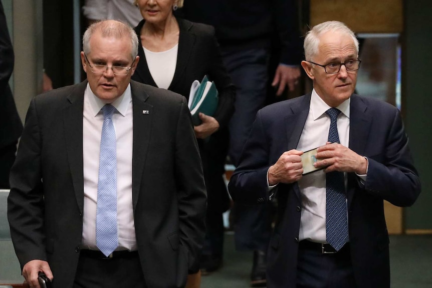 Scott Morrison and Malcolm Turnbull walk through the House of Representatives