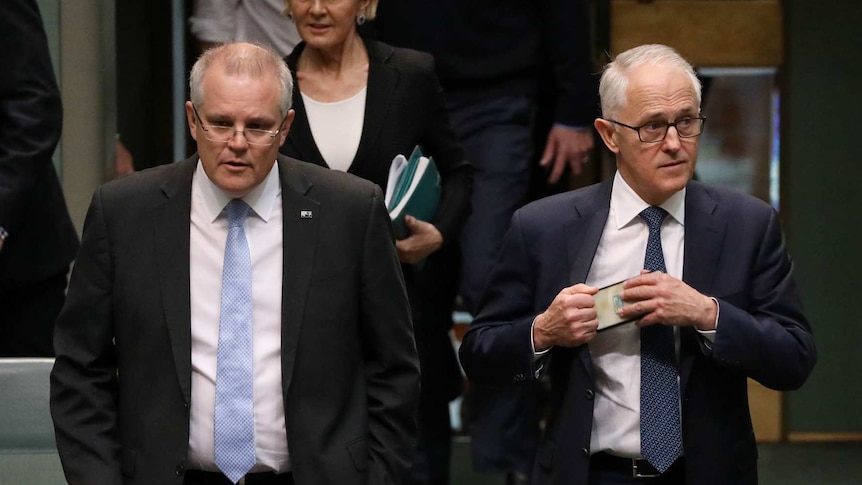 Scott Morrison and Malcolm Turnbull walk through the House of Representatives