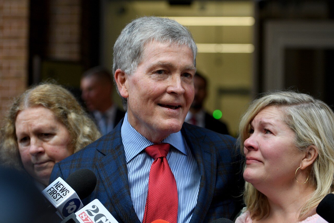 A man and a woman speaking