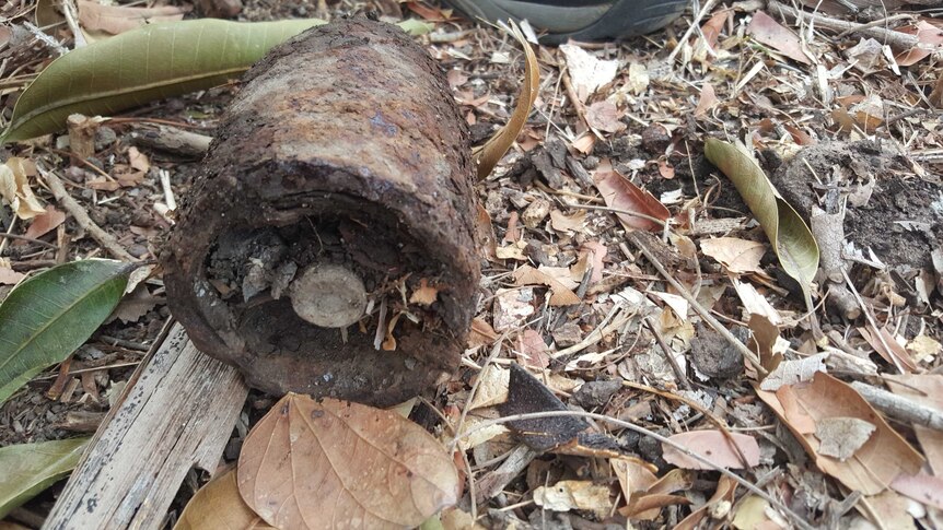 Darwin man Jeff Tinsley called police after finding this unexploded weapon while renovating his backyard