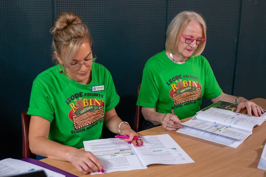 Rachelle Moore and Rosie Winterbottom Looking at a musical script,  Longreach November 2022. 