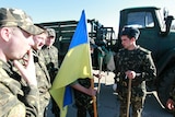 Ukrainian servicemen gather at a military base in the Crimean town of Belbek