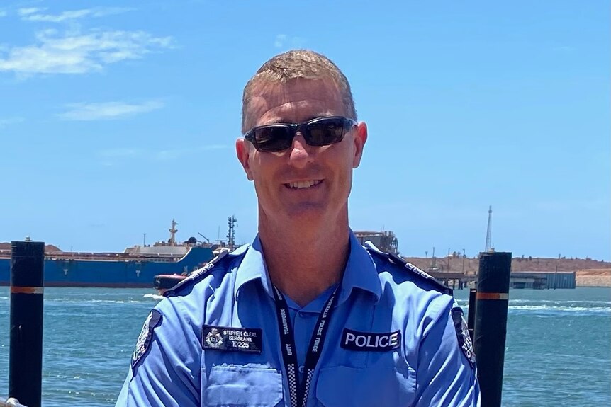 Sergeant Steve Cleal standing in front of the water in Port Hedland