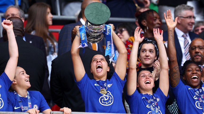 Sam Kerr shouts as she lifts the Women's FA Cup for Chelsea.