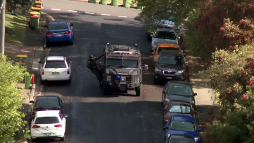 Armed police at Gosford murder siege