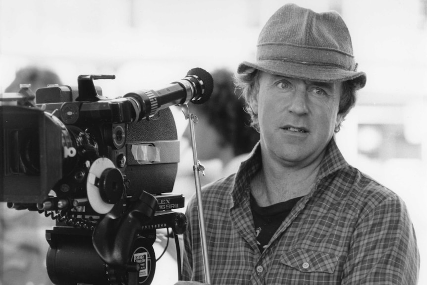 Writer and director John Clarke, with film camera for Man and Boy in 1987.