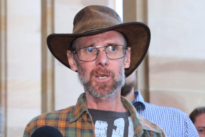 Gay rights advocate Gary Martin speaks outside WA Parliament after the Government's apology