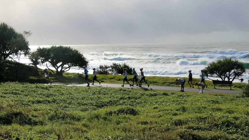 Byron Bay running group pass by the ocean