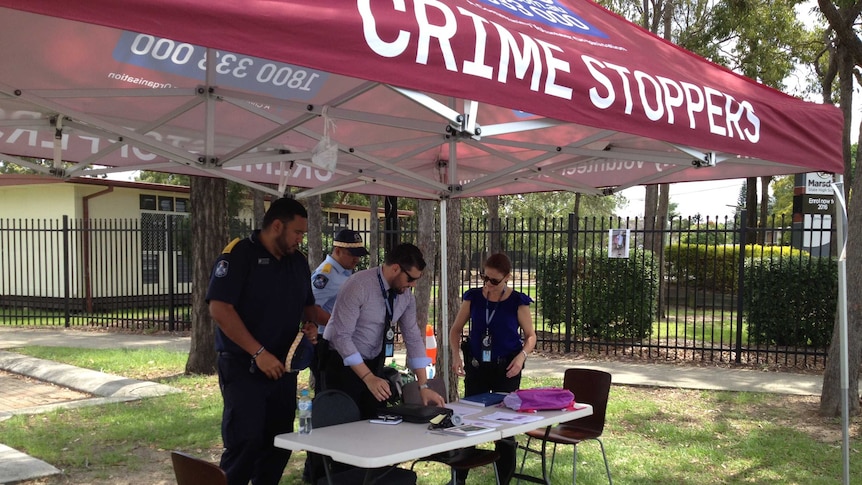 A Crime Stoppers marquee set up outside Marsden State High School