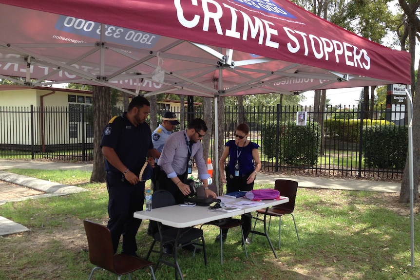 A Crime Stoppers marquee set up outside Marsden State High School