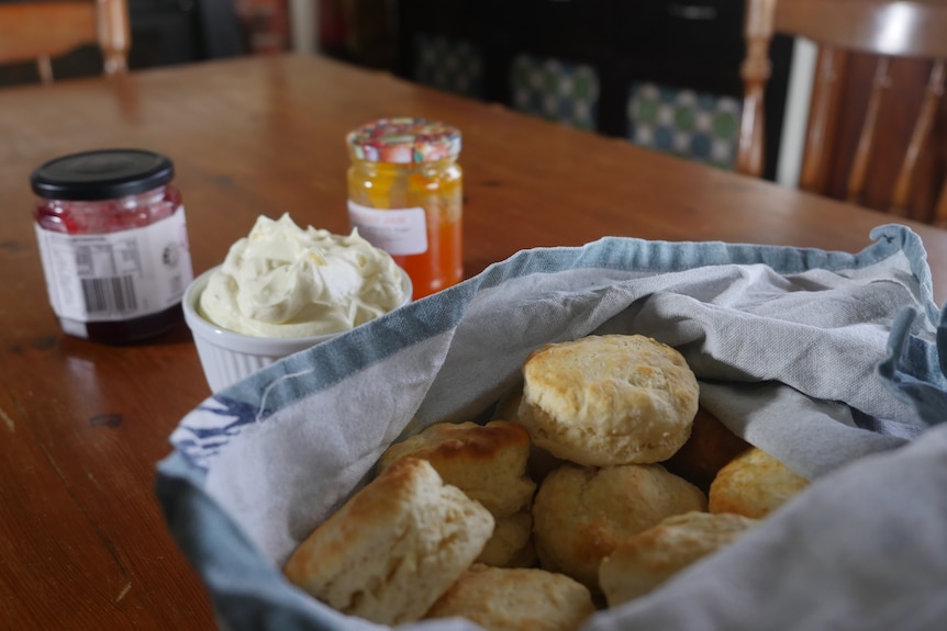 Scones jam and cream on a table