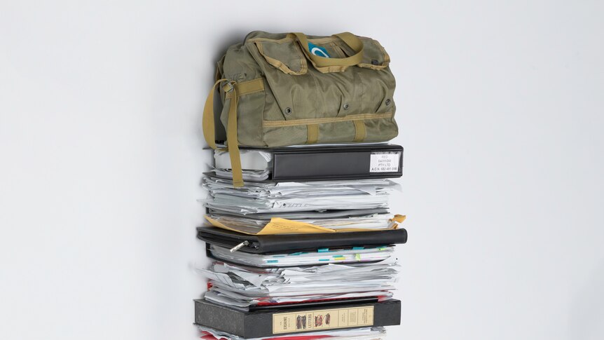 A stack of papers and bags.