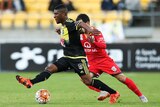Roly Bonevacia evades the Adelaide United defence