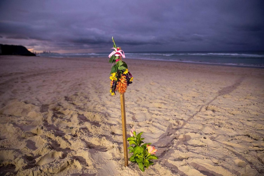 Flower memorial on Gold Coast Beach for Australian snowboarder Alex Pullin.