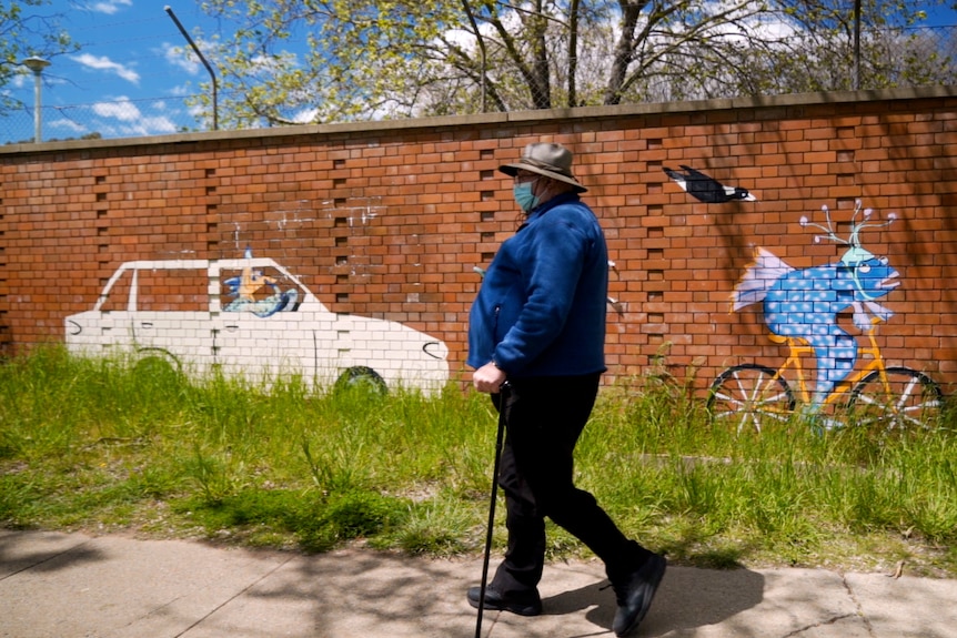 Bill Perkovic walking in Dickson.