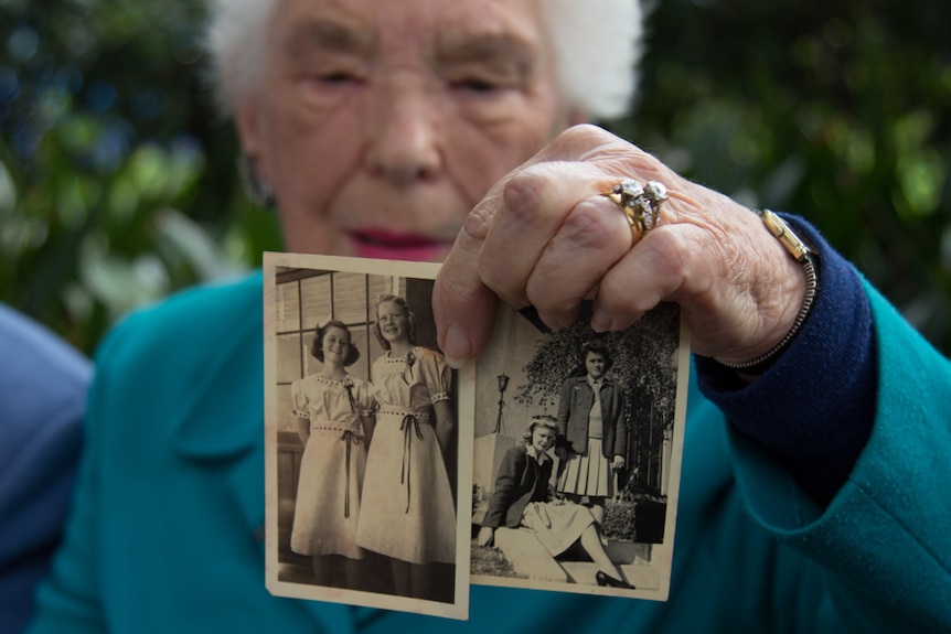 Nancie Varley holds photos from Barbara