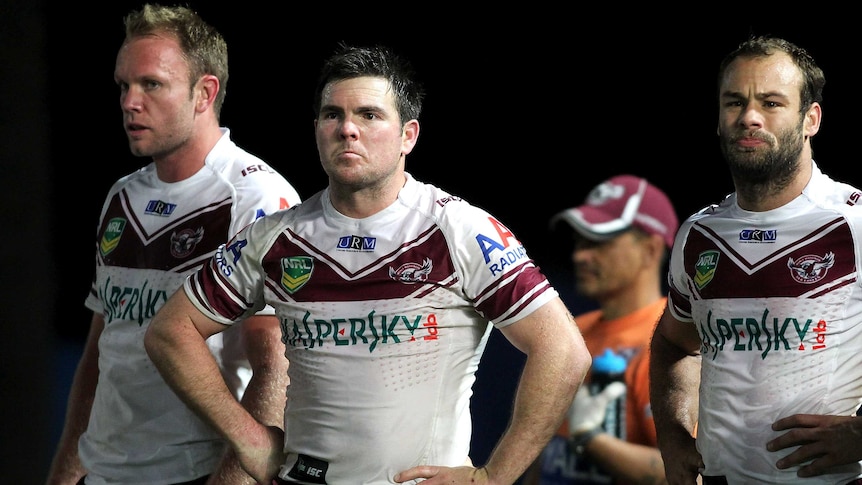 Manly players look dejected after losing to the Rabbitohs at Gosford.