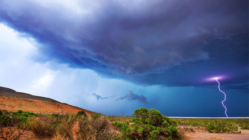 Stormy clouds gather and lightning strikes in Kalgoorlie, WA.