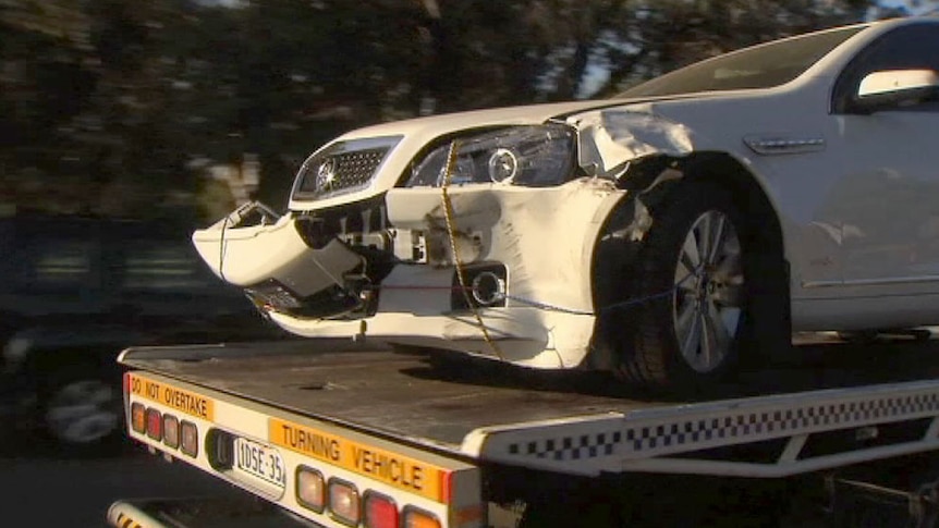 Troy Buswell's Ministerial car is towed from his home on Roberts Road in Subiaco, March 11, 2014.