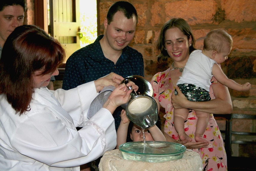 Reverend Gillian Moses baptises her grandson Edward