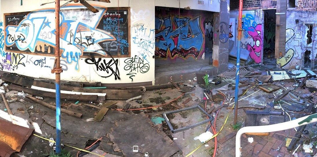 Inside the Broadway Hotel, taken sometime in 2018, showing graffiti, vandalism and debris