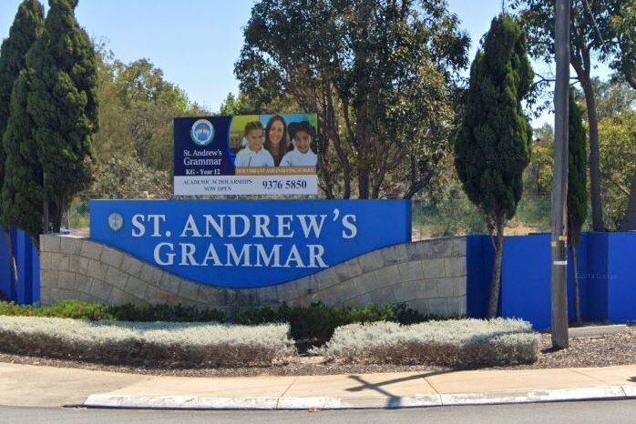 A Google Street View of a blue St Andrew's Grammar school sign on a street corner.