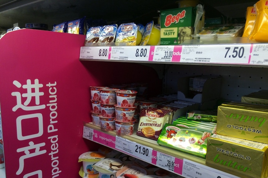 Imported cheese stacked in a supermarket shelf